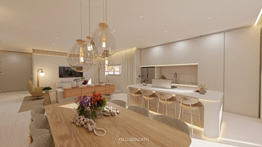 Sala de jantar integrada à cozinha com pendentes de vidro