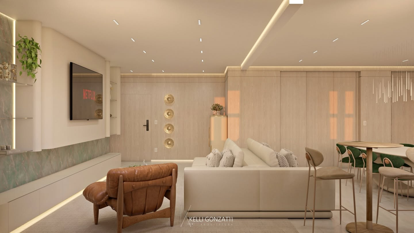 Living com poltrona de couro e marcenaria em madeira clara